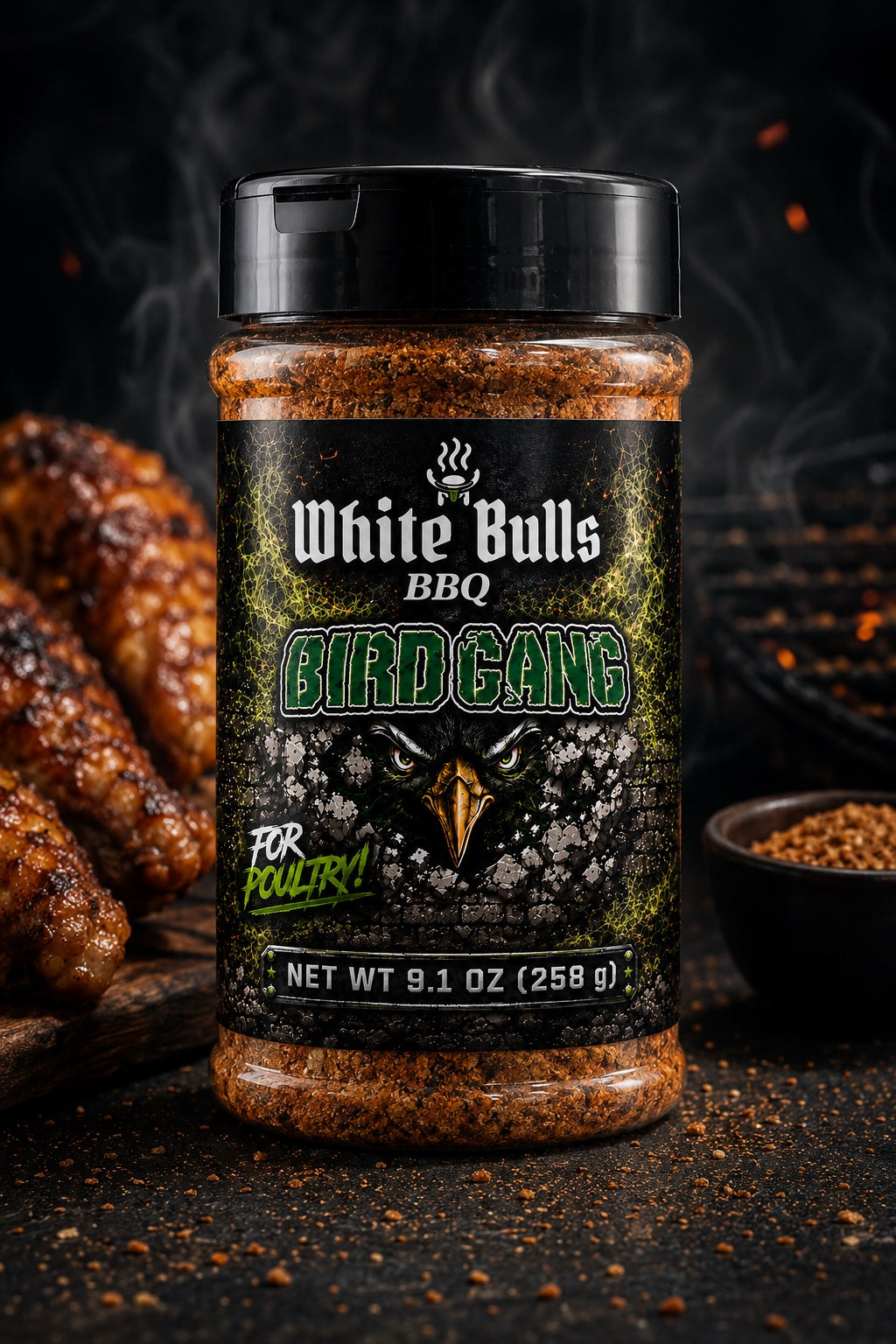 Jar of White Bulls BBQ Bird Gang seasoning for poultry on a dark background with roasted chicken.