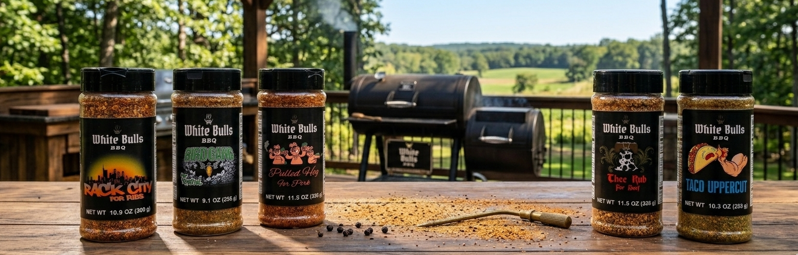 Collection of White Wolf BBQ spice blends on a wooden surface with a grill in the background.