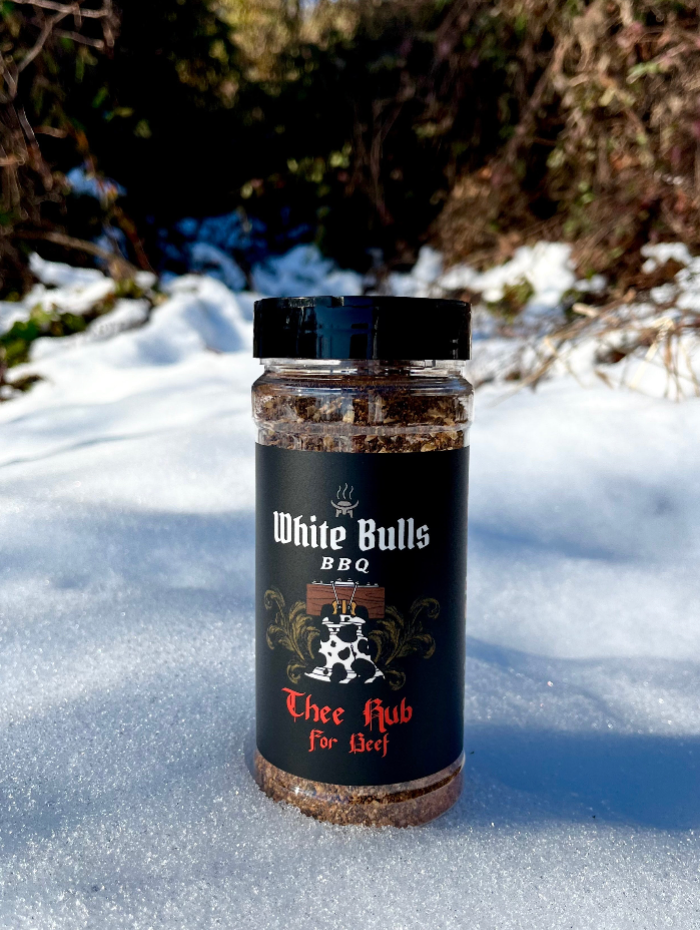 Jar of White Bulls BBQ rub in the snow